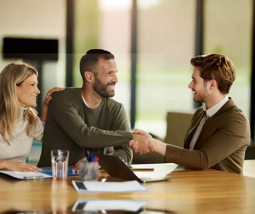 Two colleagues talking in a bright open office