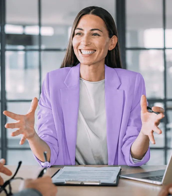 A mortgage operations lead talking through a file across a desk